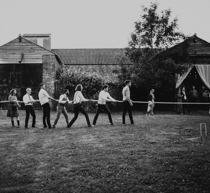 Tug of War | Fishley Hall Rustic Barn Wedding | Darina Stoda Photography