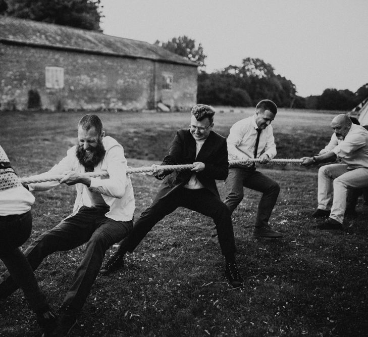 Tug of War | Fishley Hall Rustic Barn Wedding | Darina Stoda Photography