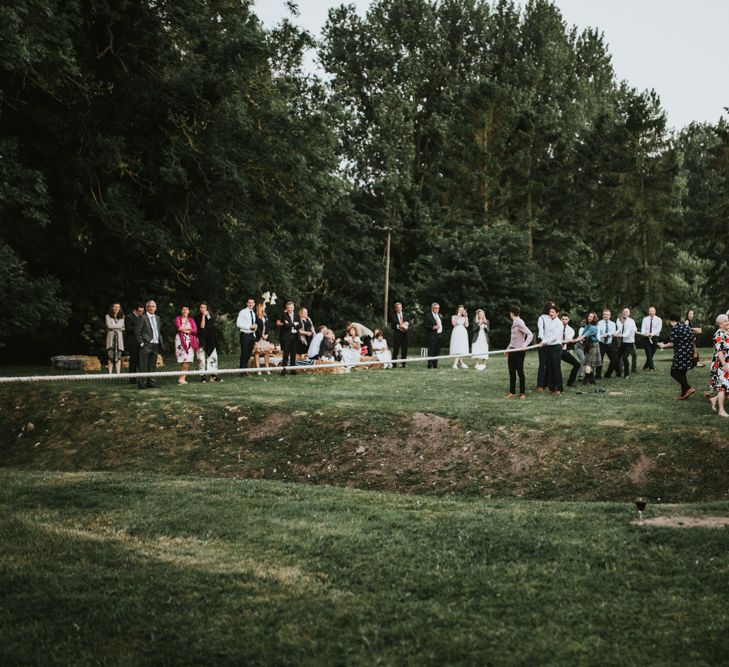 Tug of War | Fishley Hall Rustic Barn Wedding | Darina Stoda Photography