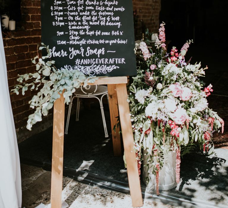 Chalkboard Order of The Day Sign | Swaffam Flowers Arrangements | Fishley Hall Rustic Barn Wedding | Darina Stoda Photography