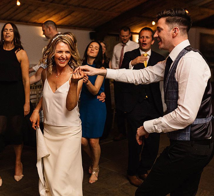 Bride In Bespoke Silk Cami & Skirt By Emma Beaumont At Owen House Wedding Barn With Bridesmaids In Blush Pink & Images From Paul Joseph Photography