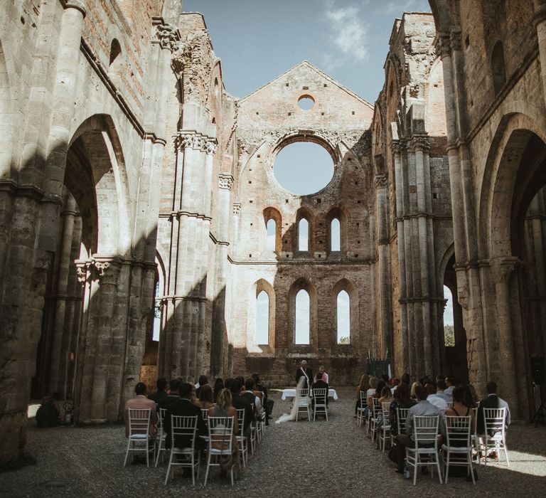 Ruin Abbey Wedding Ceremony In Tuscany // Elegant Destination Wedding In Tuscany At San Galgano Abbey With Bride In Bespoke Dress By Madame Paulette With Images From James Frost Photography