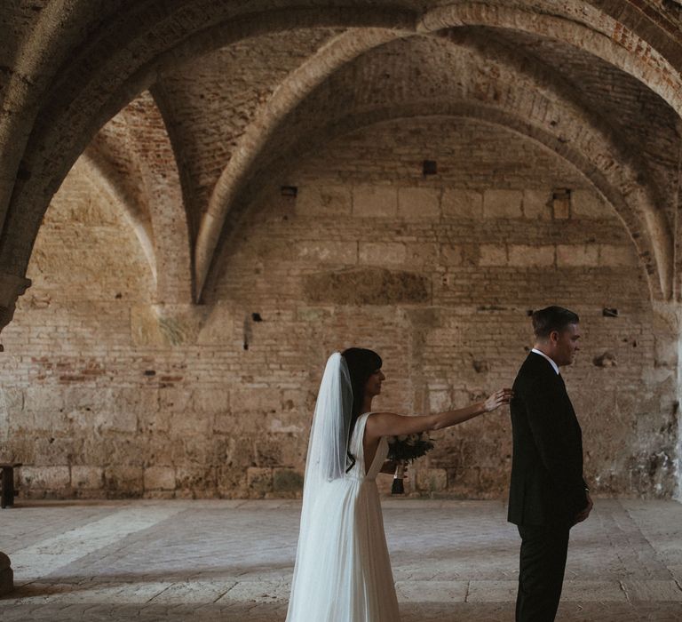 First Look At Wedding // Elegant Destination Wedding In Tuscany At San Galgano Abbey With Bride In Bespoke Dress By Madame Paulette With Images From James Frost Photography