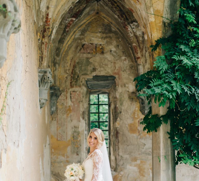 Bride in Suzanne Neville Victoriana Wedding Dress