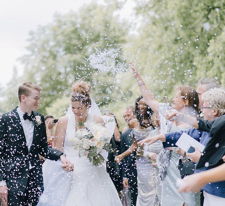 Confetti Moment | Bride in Dee Hutton Gown | Groom in Tuxedo | Classic Blue & White Wedding at Prestwold Hall in Loughborough | Georgina Harrison Photography