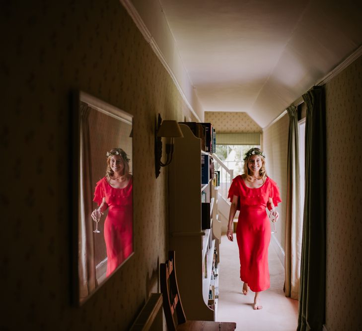 Bridesmaid in Red Reformation Dress | Bright Festival Themed At Home Wedding in a Tipi | McGivern Photography