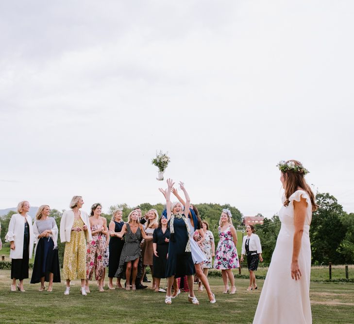 Bouquet Toss | Bright Festival Themed At Home Wedding in a Tipi | McGivern Photography