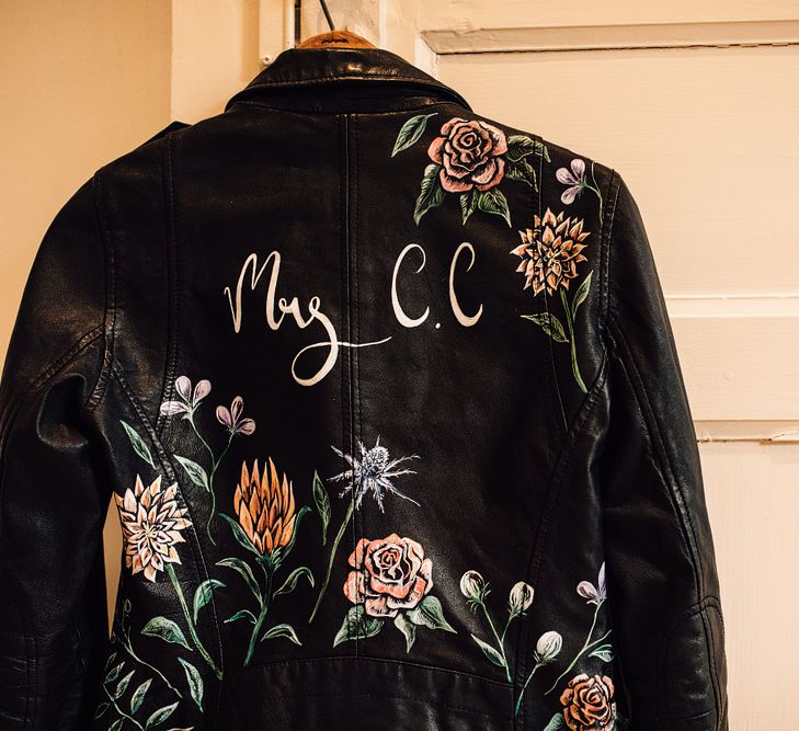 Customised Bridal Leather Jacket | Outdoor Destination Wedding at Château De Malliac Planned by Country Weddings in France | Styling by The Hand-Painted Bride | Samuel Docker Photography | Marriage in Motion Films