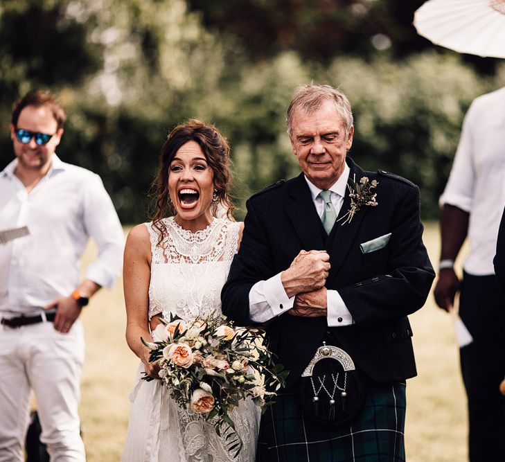 Wedding Ceremony with Bridal Entrance in Lace Yolan Cris Gown | Outdoor Destination Wedding at Château De Malliac Planned by Country Weddings in France | Styling by The Hand-Painted Bride | Samuel Docker Photography | Marriage in Motion Films