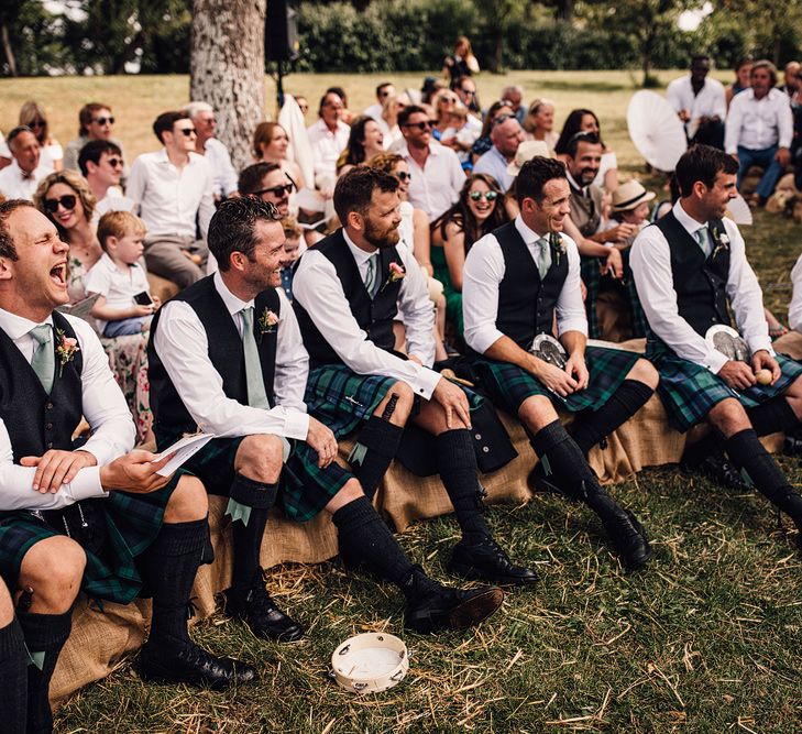 Wedding Ceremony | Groomsmen in Slater Tartan Kilts | Outdoor Destination Wedding at Château De Malliac Planned by Country Weddings in France | Styling by The Hand-Painted Bride | Samuel Docker Photography | Marriage in Motion Films