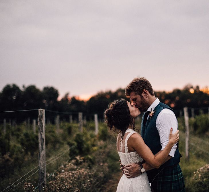 Sunset | Bride in Yolan Cris Lace Gown | Groom in Tartan Kilt | Outdoor Destination Wedding at Château De Malliac Planned by Country Weddings in France | Styling by The Hand-Painted Bride | Samuel Docker Photography | Marriage in Motion Films