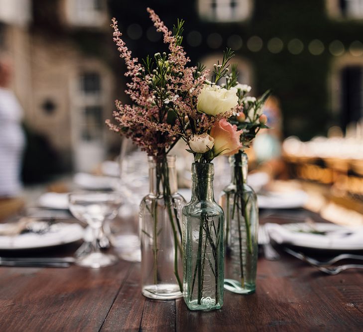 Flower Stems in Bottles | Outdoor Destination Wedding at Château De Malliac Planned by Country Weddings in France | Styling by The Hand-Painted Bride | Samuel Docker Photography | Marriage in Motion Films