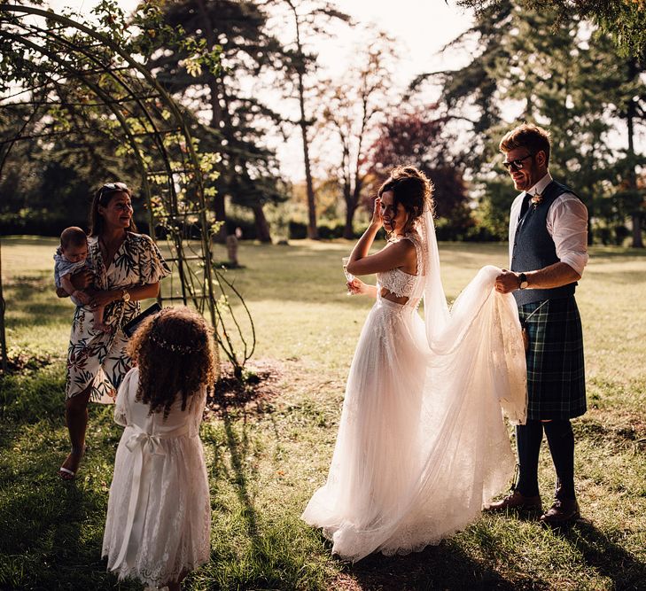 Bride in Yolan Cris Gown | Groom in Tatan Kilt | Outdoor Destination Wedding at Château De Malliac Planned by Country Weddings in France | Styling by The Hand-Painted Bride | Samuel Docker Photography | Marriage in Motion Films