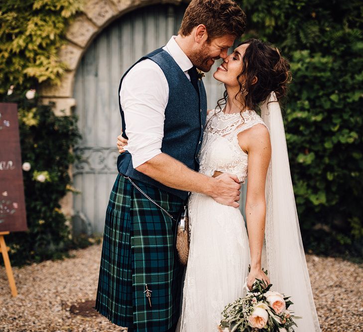 Bride in Yolan Cris Lace Gown | Groom in Tartan Kilt | Outdoor Destination Wedding at Château De Malliac Planned by Country Weddings in France | Styling by The Hand-Painted Bride | Samuel Docker Photography | Marriage in Motion Films