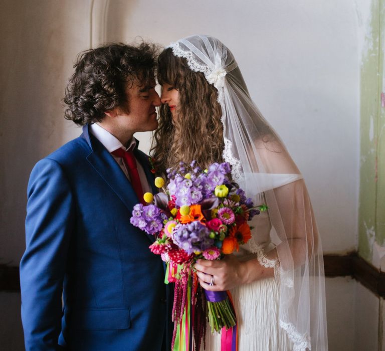 Bride in Charlie Brear Wedding Dress & Colourful Bouquet