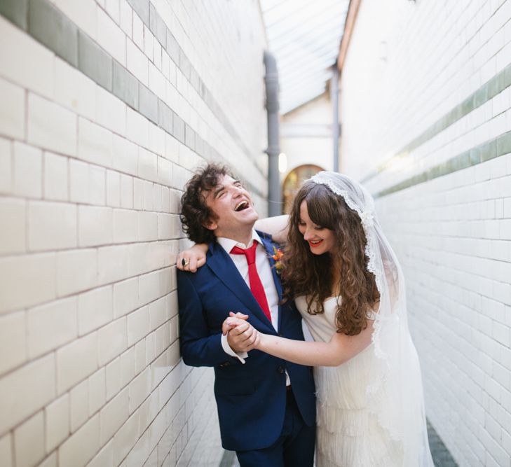 Bride in Charlie Brear Wedding Dress & Colourful Bouquet