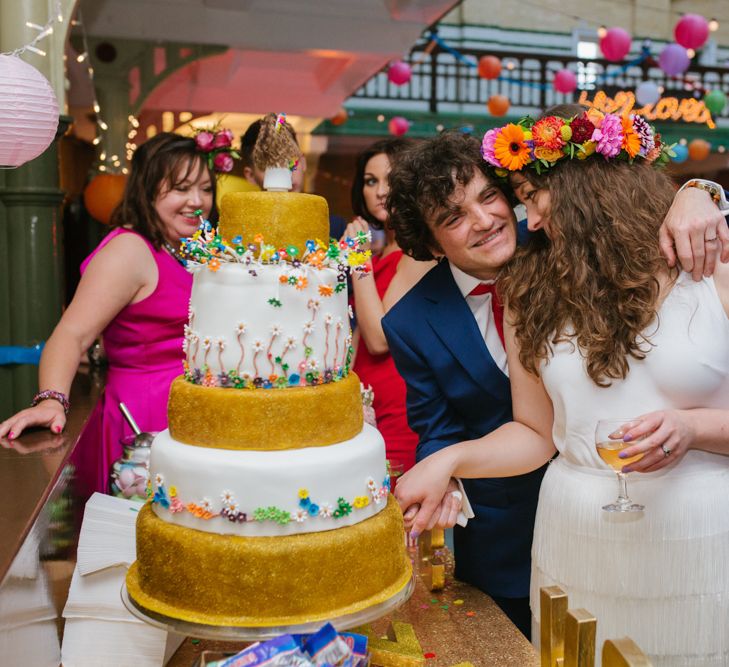 Bride & Groom Cutting The Cake