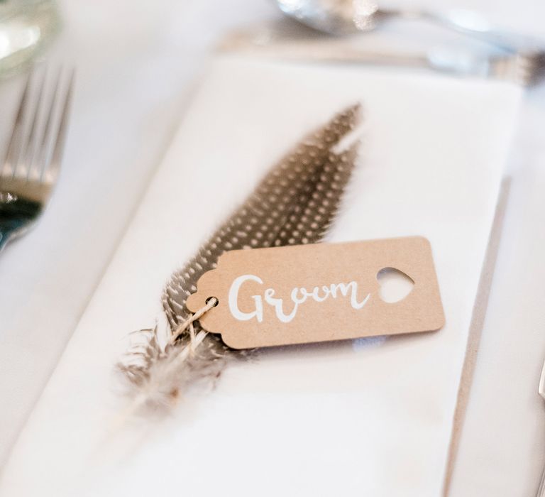 Kraft Place Name Tag & Feather Wedding Decor | Romantic Peach & Coral Floral Centrepiece | Peach & Coral Country Wedding at Crabbs Barn, Essex | Kathryn Hopkins Photography | Film by Colbridge Media Services Ltd