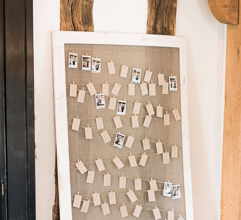 Escort Card Seating Chart with Tags & Polaroid Pictures | Romantic Peach & Coral Floral Centrepiece | Peach & Coral Country Wedding at Crabbs Barn, Essex | Kathryn Hopkins Photography | Film by Colbridge Media Services Ltd