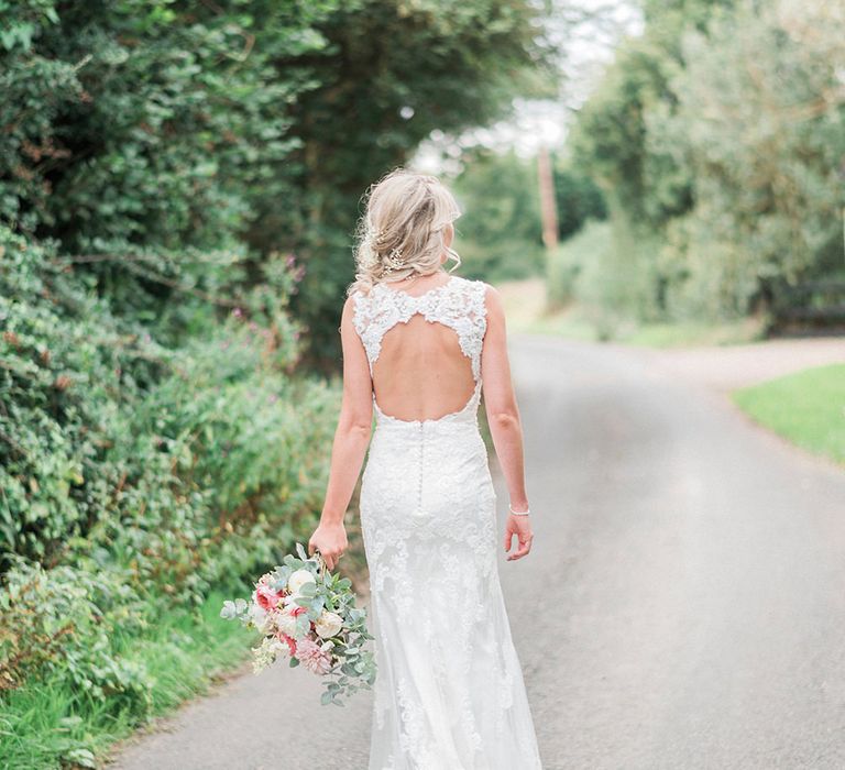 Bride in Lace Enzoani 'Inaru' Bridal Gown with Keyhole Back | Romantic Pink & Coral Bouquet with Roses & Dahlias | Peach & Coral Country Wedding at Crabbs Barn, Essex | Kathryn Hopkins Photography | Film by Colbridge Media Services Ltd