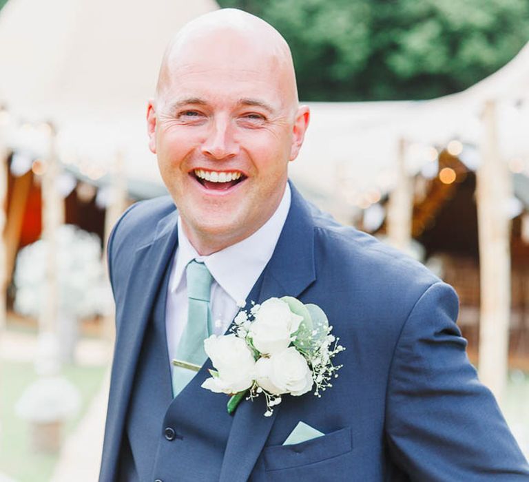 Groom in Three Piece Navy Suit