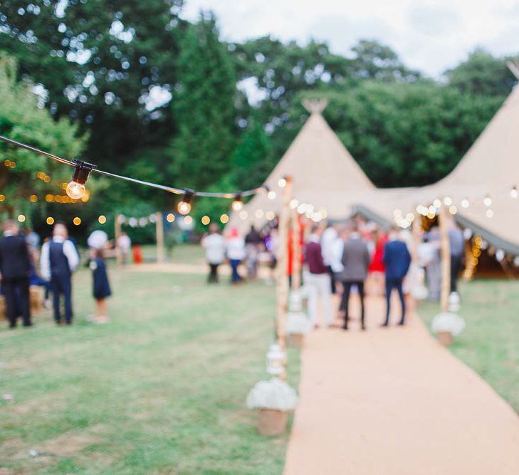 Outdoor Tipi Reception with Festoon Lights