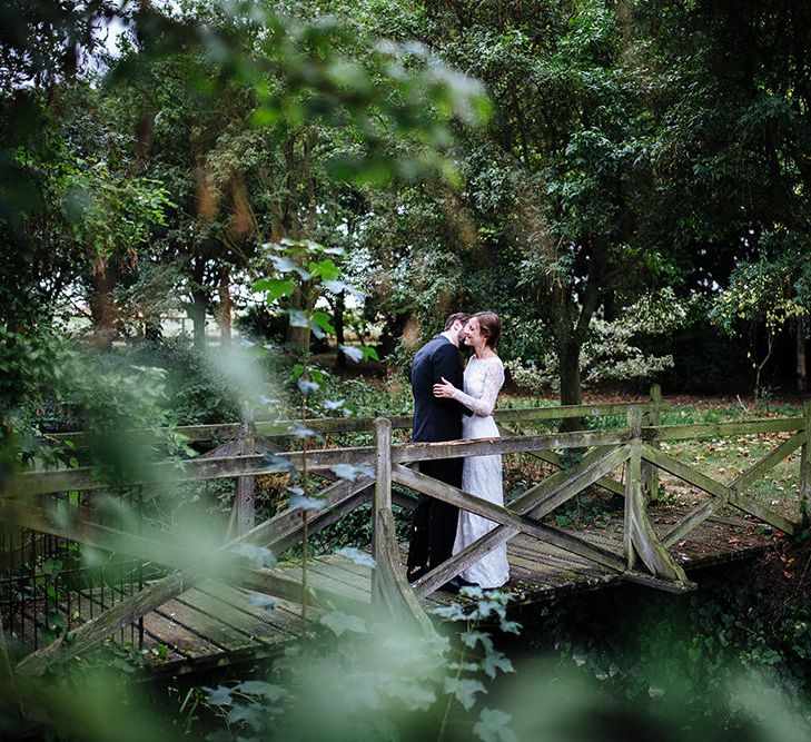 Childerley Hall Wedding | Bride in Lace Sottero & Midgley Gown | Groom in Herrvon Eden Tuxedo | Tawny Photo