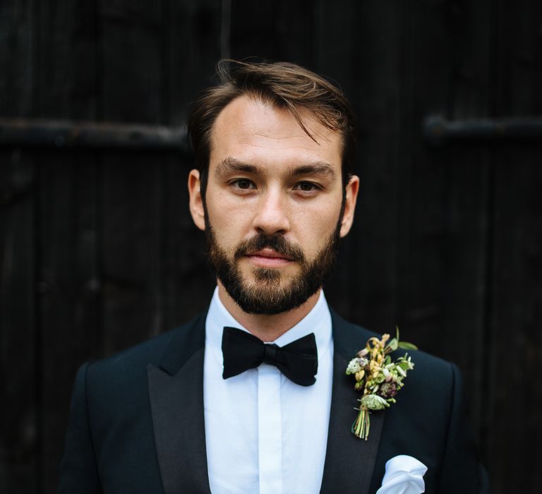 Groom in Herrvon Eden Tuxedo | Grooms Buttonhole | Tawny Photo