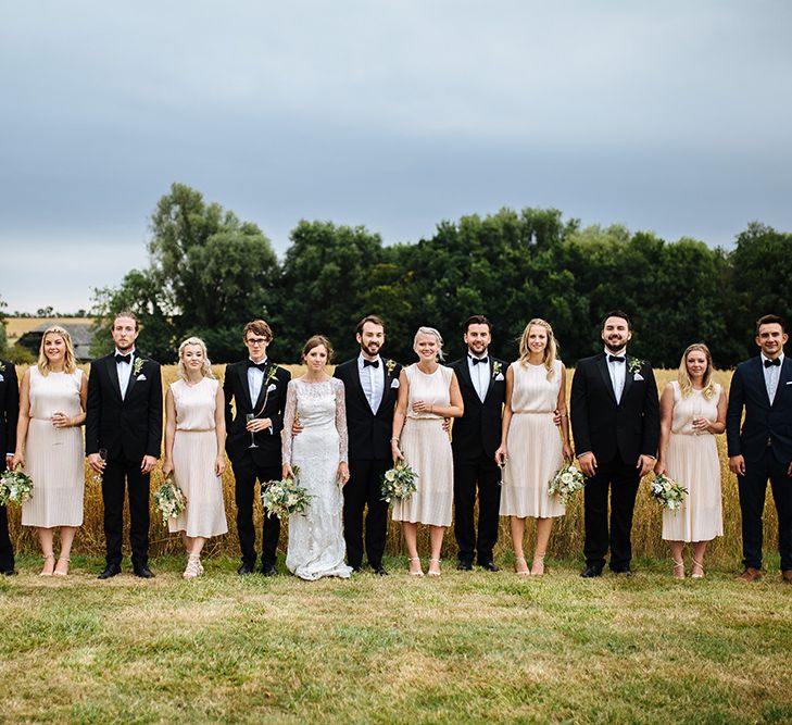 Wedding Party | Bride in Maggie Sottero Lace Gown | Groom in Herrvon Eden Tuxedo | Tawny Photo