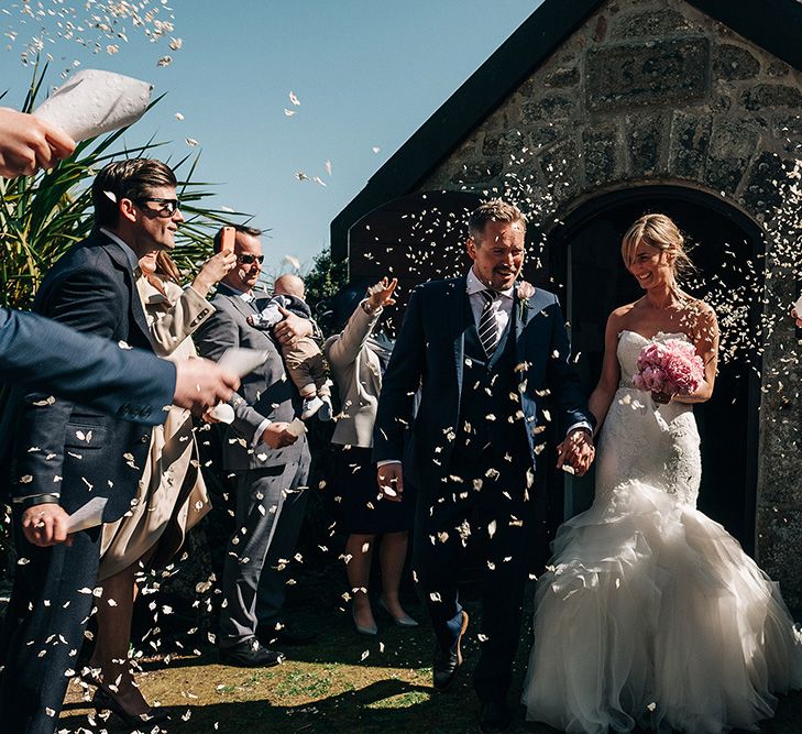 Confetti Moment | Bride in Pronovias Wedding Dress | Groom in Navy Ted Baker Suit | Isles of Scilly Wedding | Jason Mark Harris Photography