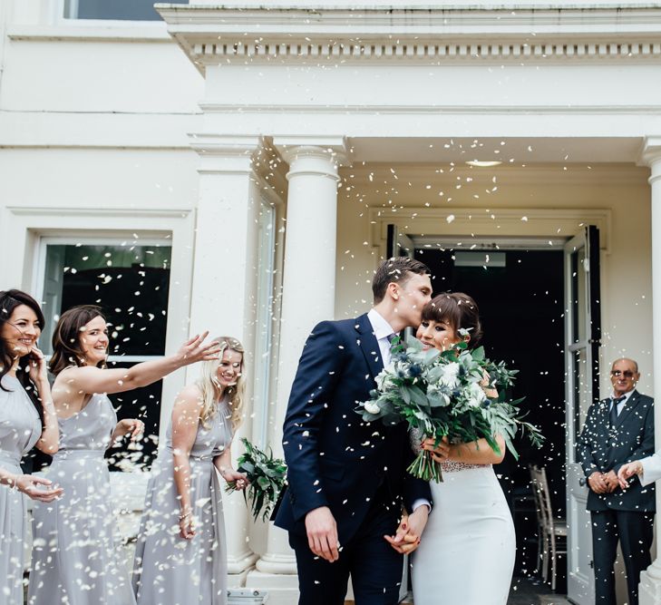 Confetti Moment | Bride in Illusion Back Martina Liana Bridal Gown | Groom in Gieves & Hawkes Suit | Modern Hall London | Beatrici Photography