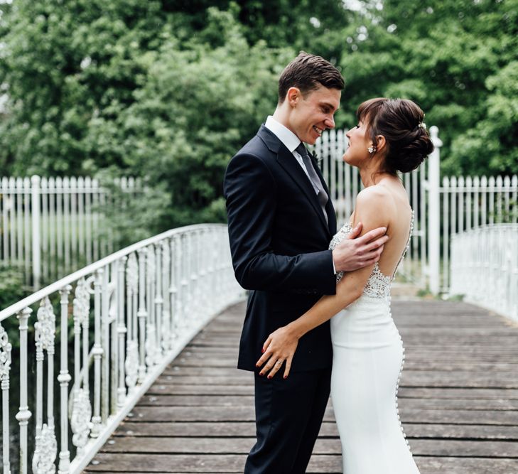 Bride in Illusion Back Martina Liana Bridal Gown | Groom in Gieves & Hawkes Suit | Modern Hall London | Beatrici Photography