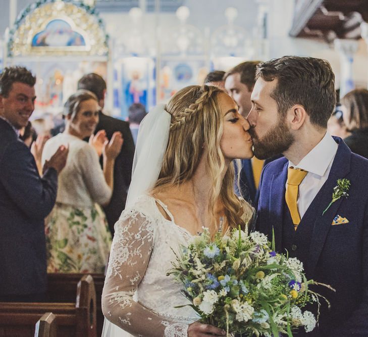 Bride in Inbral Dror Wedding Dress & Groom in Navy Beggars Run Suit