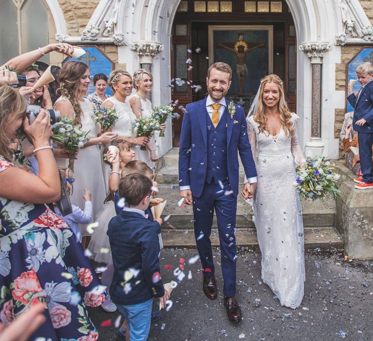 Bride in Inbral Dror Wedding Dress & Groom in Navy Beggars Run Suit