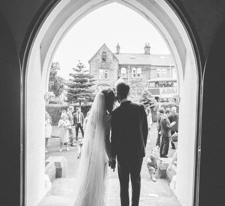 Bride in Inbral Dror Wedding Dress & Groom in Navy Beggars Run Suit