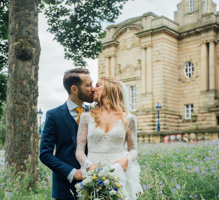 Bride in Inbral Dror Wedding Dress & Groom in Navy Beggars Run Suit