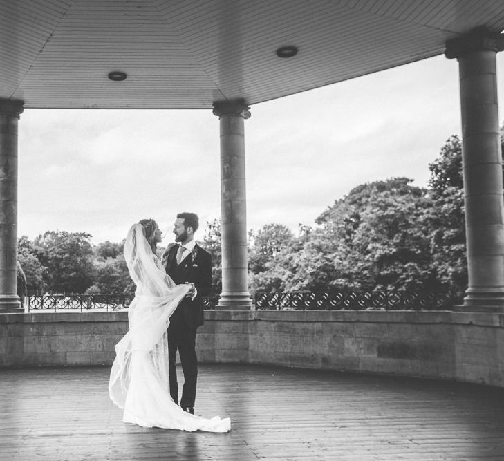 Bride in Inbral Dror Wedding Dress & Groom in Navy Beggars Run Suit