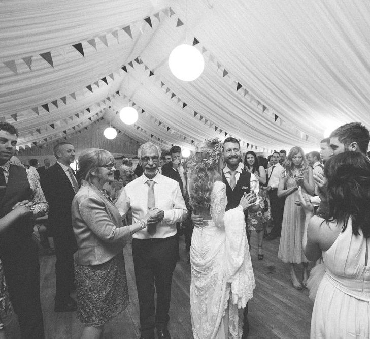 Bride in Inbral Dror Wedding Dress & Groom in Navy Beggars Run Suit