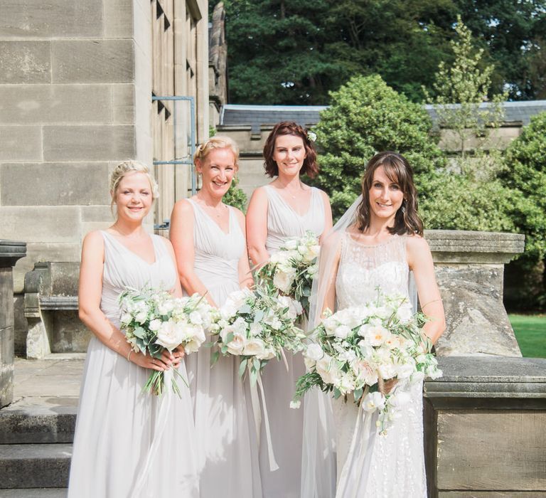 Bridesmaids in Grey Dessy Dresses | Bride in Jenny Packham | Elegant Hampton Manor Wedding with Floral Decor | Xander & Thea Fine Art Wedding Photography