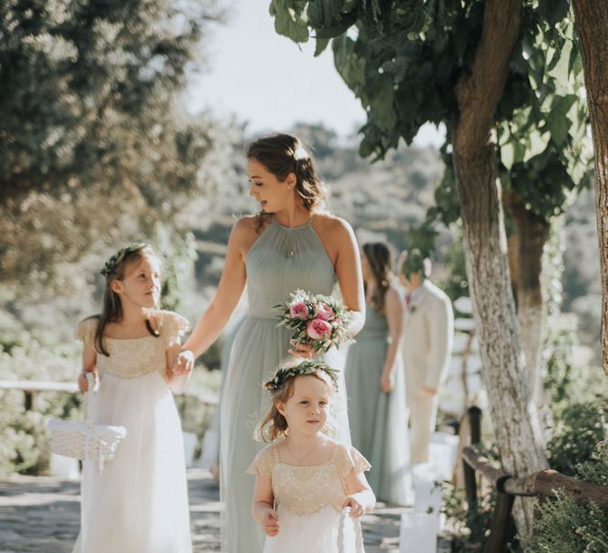 Bridal Party | Flower Girls in Monsoon | Bridesmaids in Pale Green For Her and For Him Gowns | Outdoor Pastel Destination Wedding at Agreco in Greece | Best Moments Wedding Planner | Paulina Weddings Photography