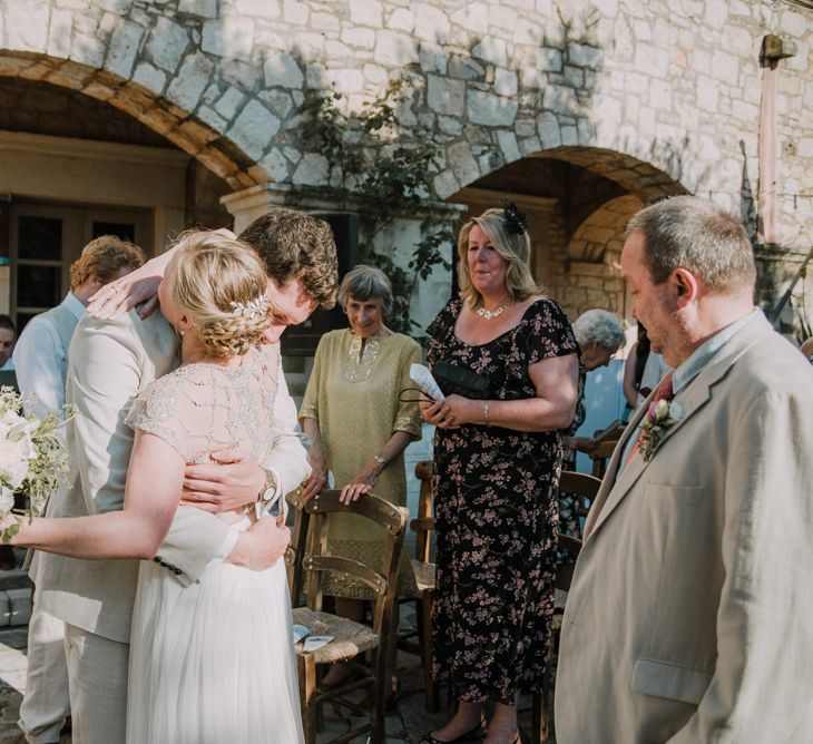 Wedding Ceremony | Bride in Catherine Deane Gown | Groom in Beige Austin Reed Suit | Outdoor Pastel Destination Wedding at Agreco in Greece | Best Moments Wedding Planner | Paulina Weddings Photography