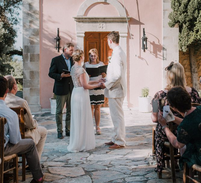 Wedding Ceremony | Bride in Catherine Deane Gown | Groom in Beige Austin Reed Suit | Outdoor Pastel Destination Wedding at Agreco in Greece | Best Moments Wedding Planner | Paulina Weddings Photography