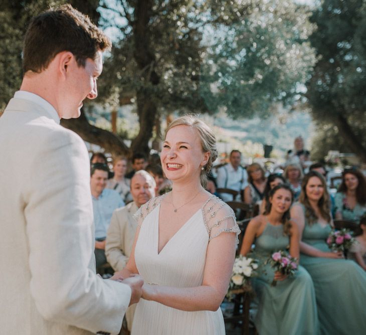 Wedding Ceremony | Bride in Catherine Deane Gown | Groom in Beige Austin Reed Suit | Outdoor Pastel Destination Wedding at Agreco in Greece | Best Moments Wedding Planner | Paulina Weddings Photography