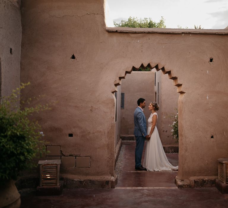 Bride in Celestina Agostino Wedding Dress | Groom in Light Blue Suit | Beldi Hotel, Marrakech Destination Wedding | Lifestories Wedding Photography