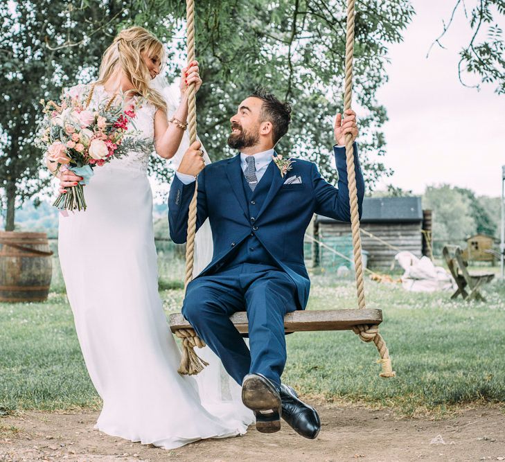 Bride in Ivy & Aster Bridal Gown | Groom in Navy Reiss Suit | Rustic Wedding at Yoghurt Rooms in Sussex | Louise Griffin Photography