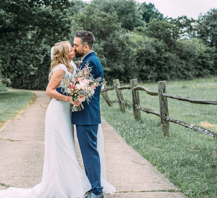 Bride in Ivy & Aster Bridal Gown | Groom in Navy Reiss Suit | Rustic Wedding at Yoghurt Rooms in Sussex | Louise Griffin Photography