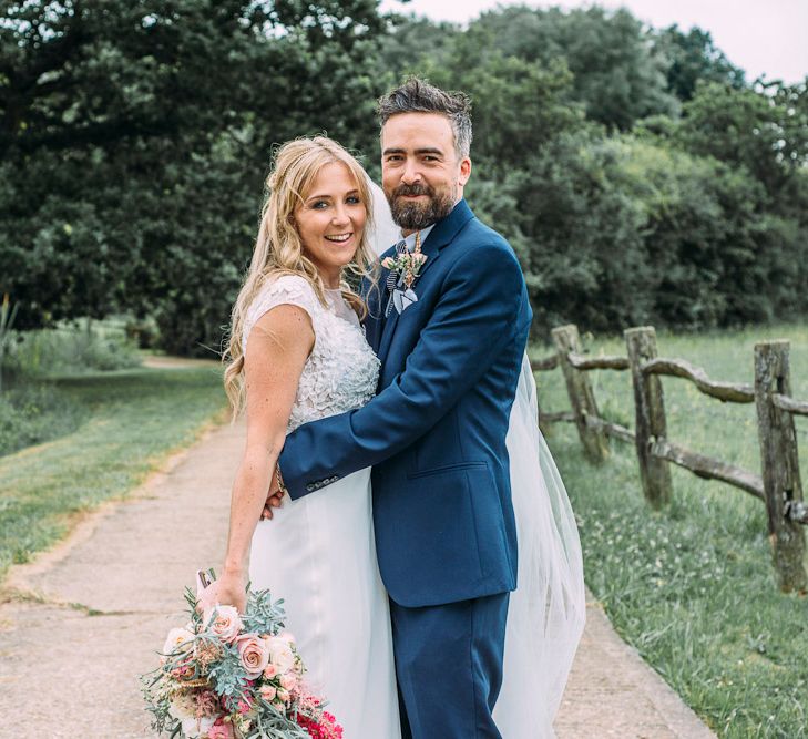 Bride in Ivy & Aster Bridal Gown | Groom in Navy Reiss Suit | Rustic Wedding at Yoghurt Rooms in Sussex | Louise Griffin Photography