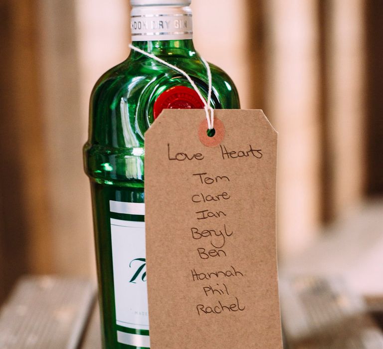 Wine Bottle & Craft Tag Table Plan | Rustic Wedding at Yoghurt Rooms in Sussex | Louise Griffin Photography