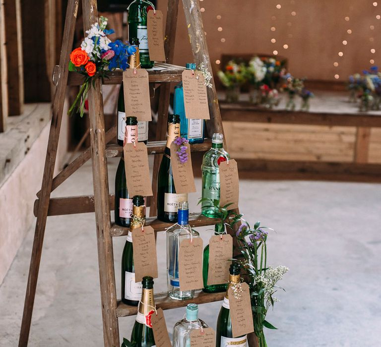 Vintage Step Ladder with Wine Bottle Table Plan | Wedding Decor | Rustic Wedding at Yoghurt Rooms in Sussex | Louise Griffin Photography