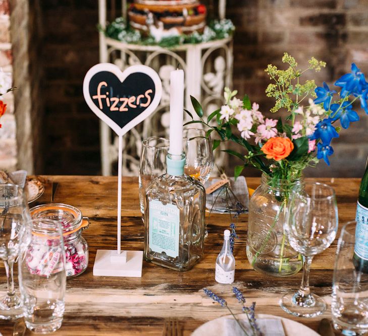 Sweet Table Names | Flower Stems in Bottles & Jars | Wedding Decor | Rustic Wedding at Yoghurt Rooms in Sussex | Louise Griffin Photography